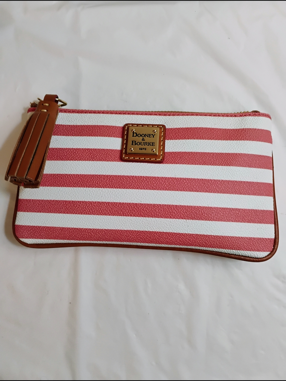 Dooney & Bourke Pink and White Striped Wristlet with Tan Tassel